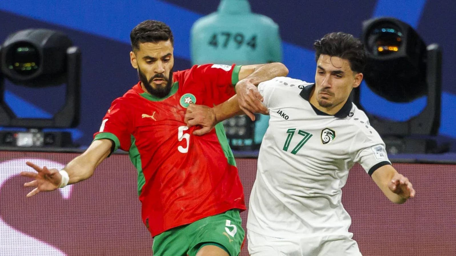 Two players battling for the ball during match