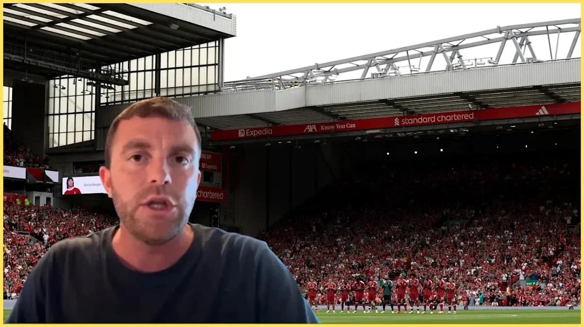 Presenter speaking in front of Anfield stadium crowd