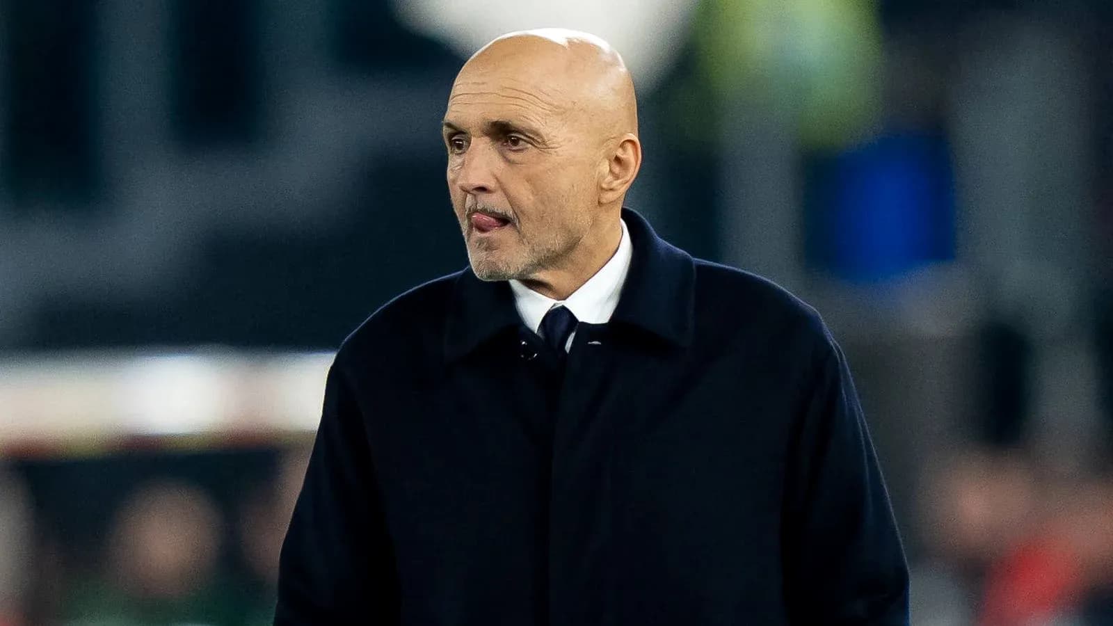 Manager walking on the sidelines during match