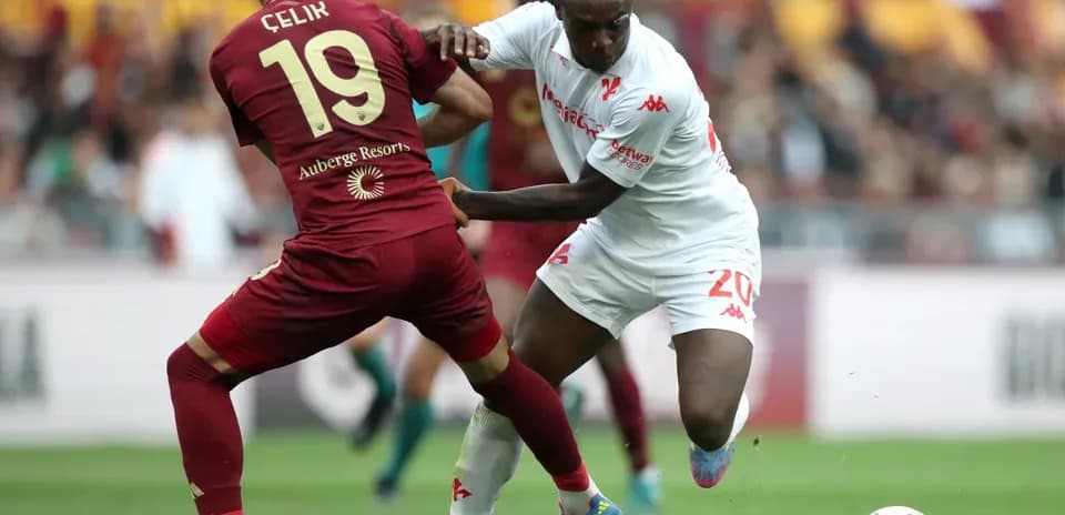 Çelik and player competing for the ball