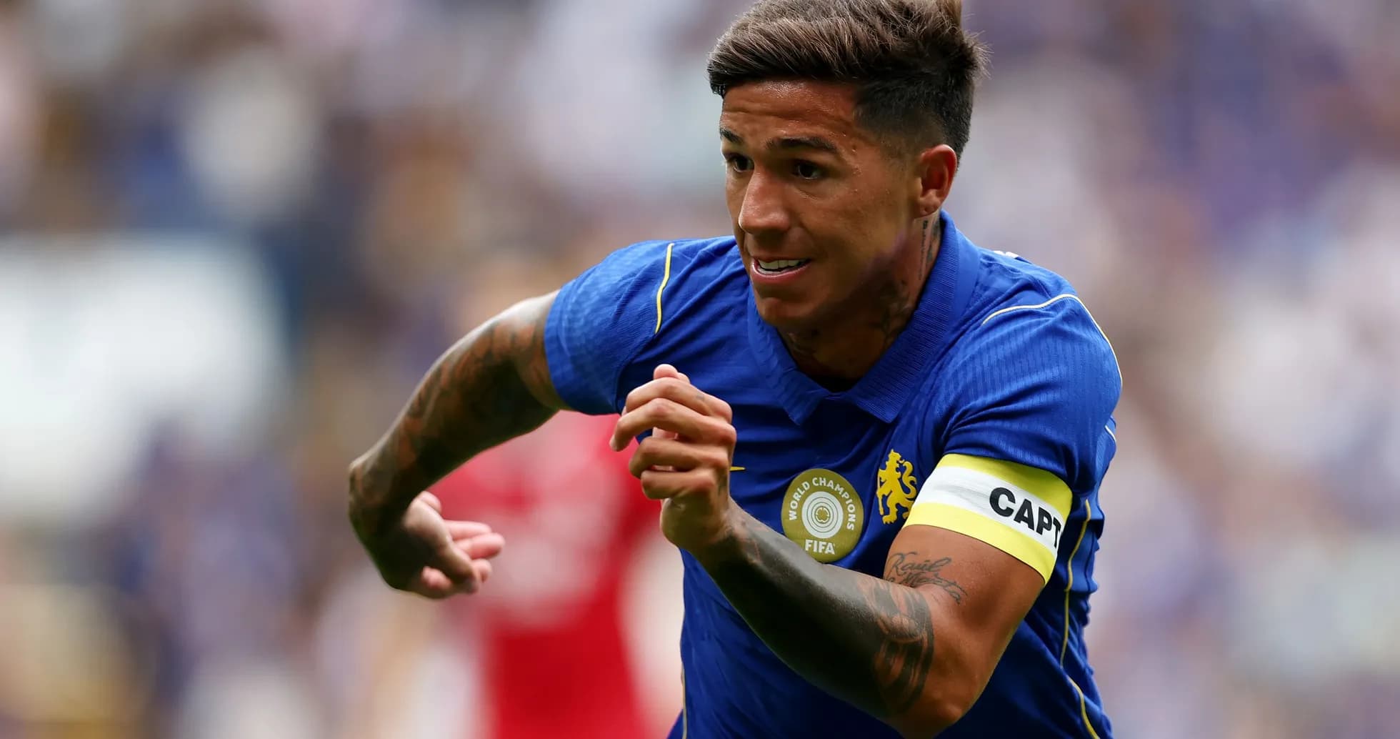 Player in blue jersey sprinting during match