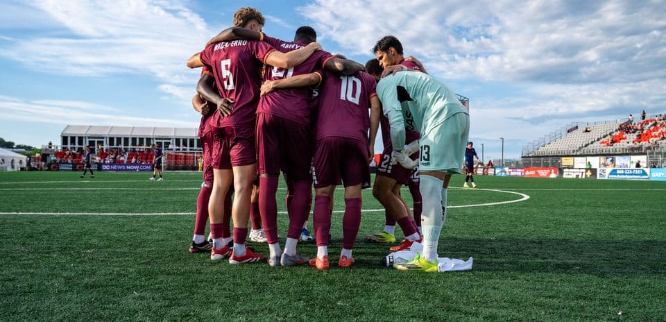 Players huddled before USL League One match