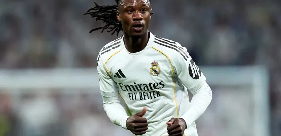 Player running on the pitch in Real Madrid kit