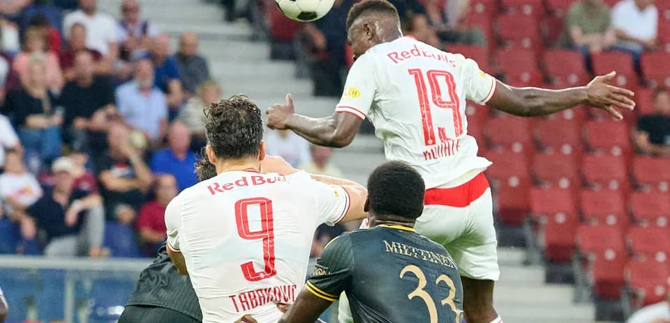Red Bull Salzburg players competing for a header