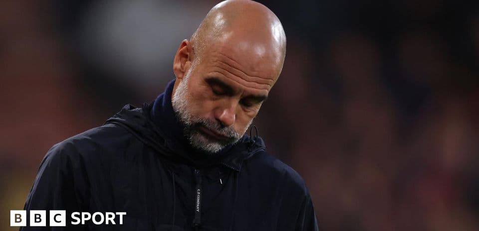 Manager looking down during match at stadium