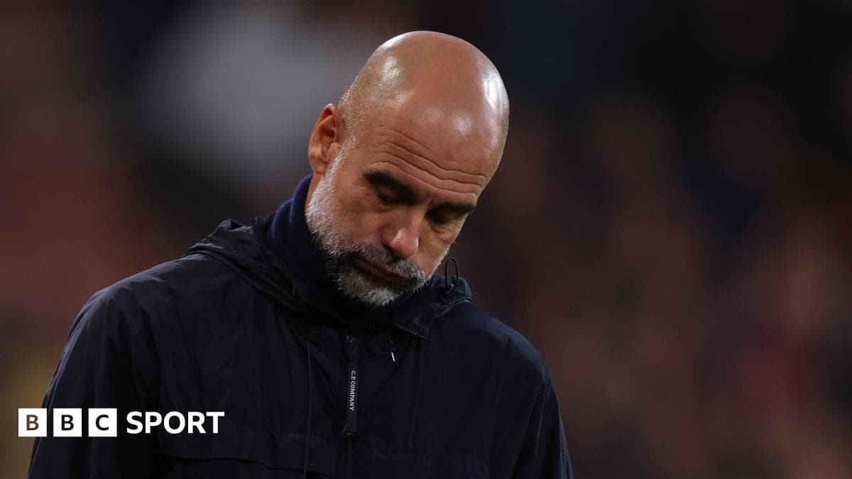 Manager looking down during match at stadium
