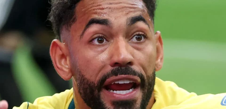 Player in yellow jersey reacting during match