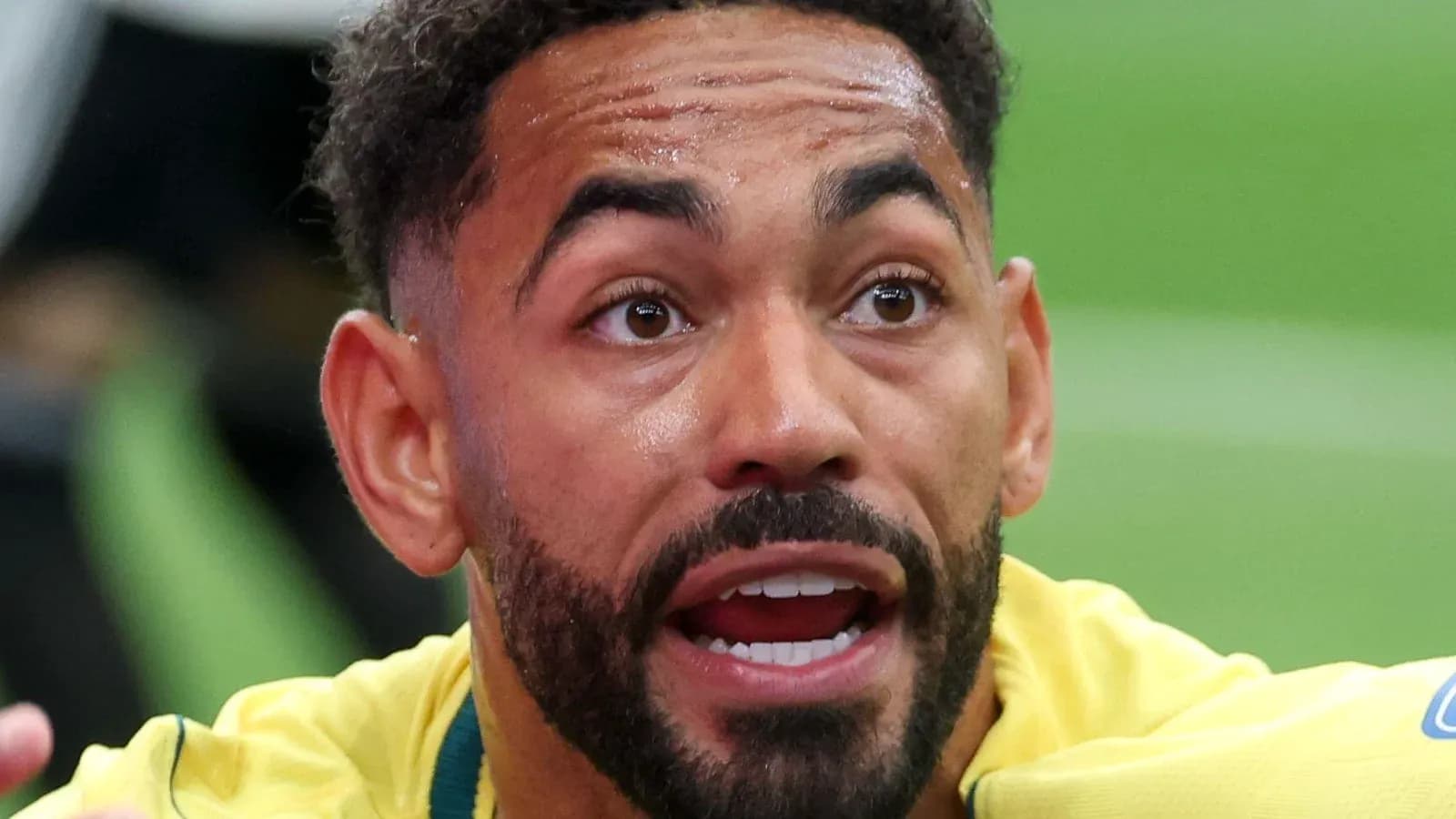 Player in yellow jersey reacting during match
