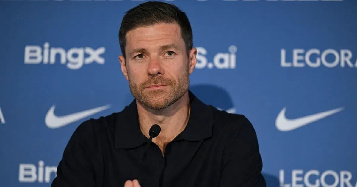 Manager at press conference with branding backdrop