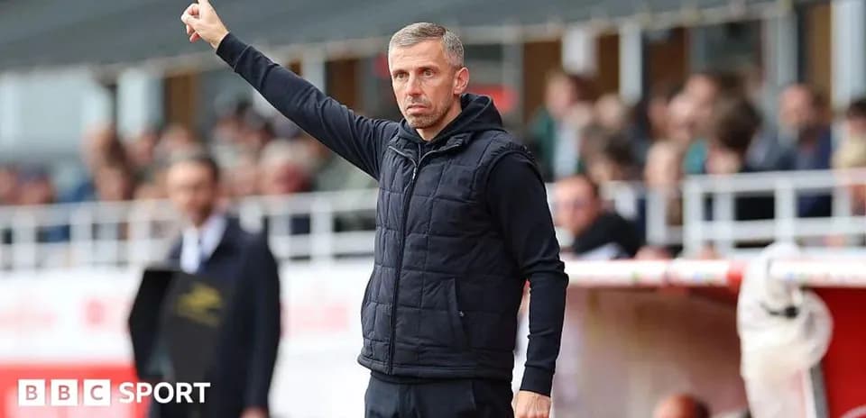 Manager signaling during a football match from sidelines