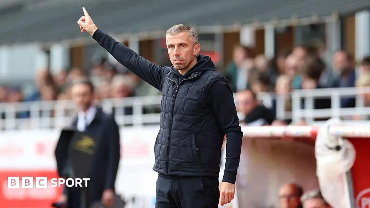 Manager signaling during a football match from sidelines