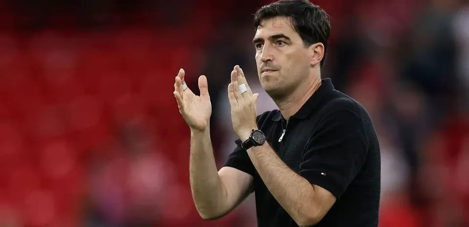 Coach applauding during match on the sidelines