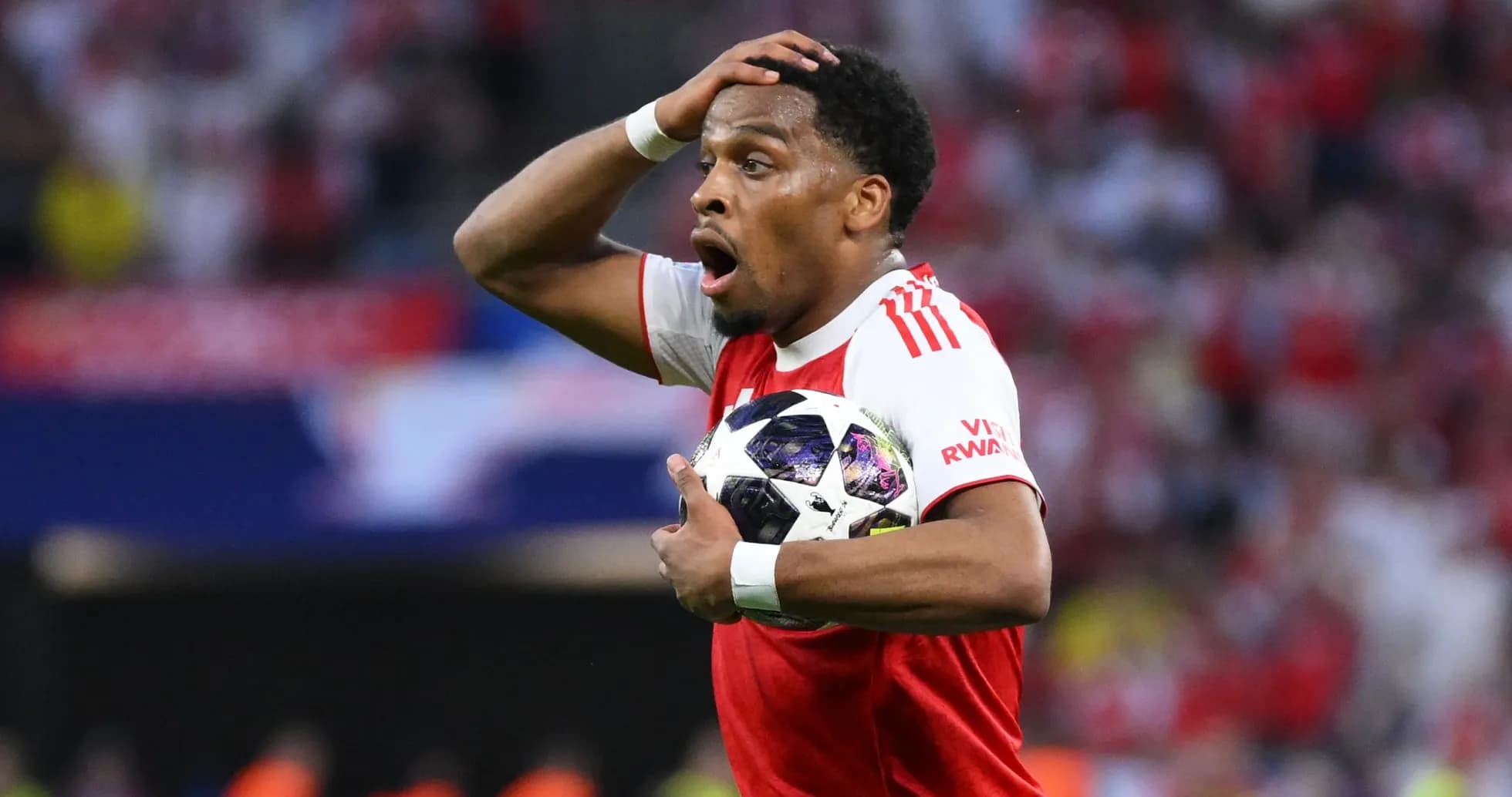 Player holding ball, showing surprise during match