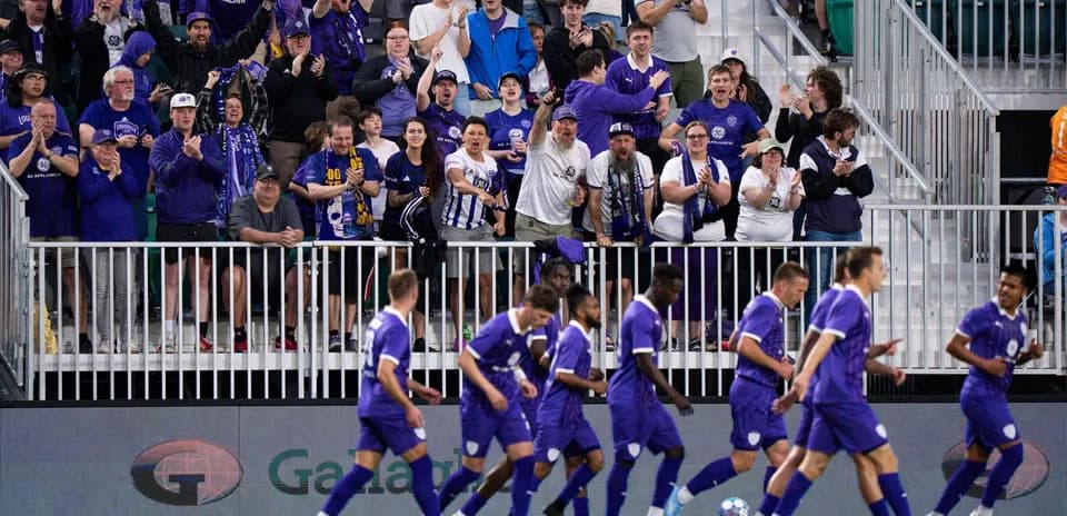 Louisville City fans celebrating during the match