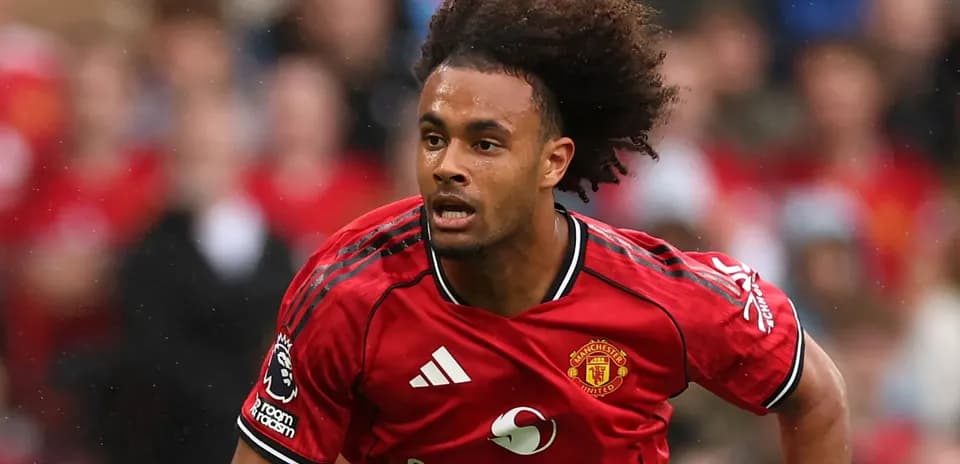 Player in red Manchester United kit running on field
