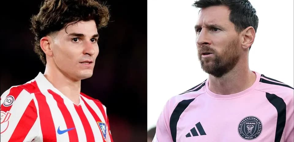 Two soccer players in jerseys facing each other