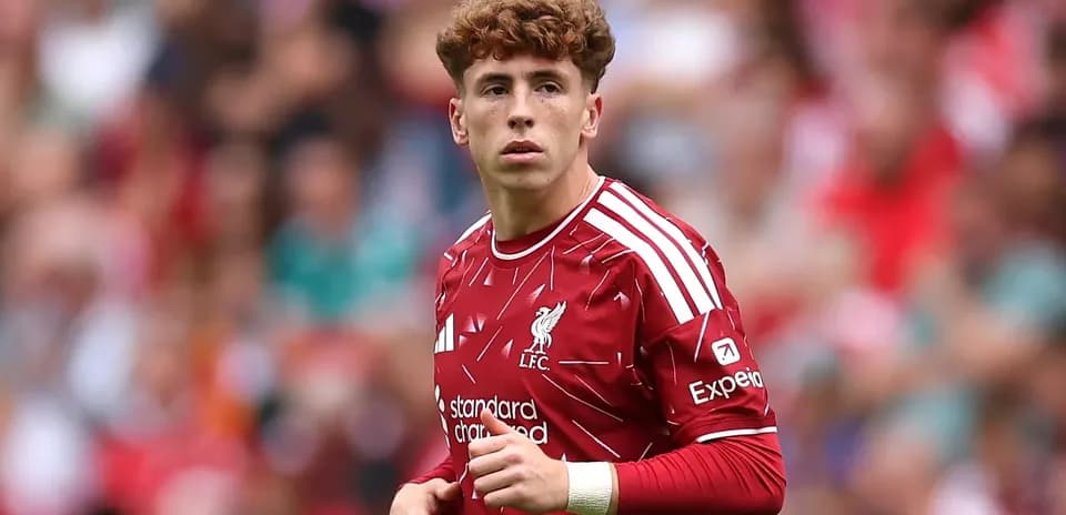Player wearing Liverpool kit on the pitch