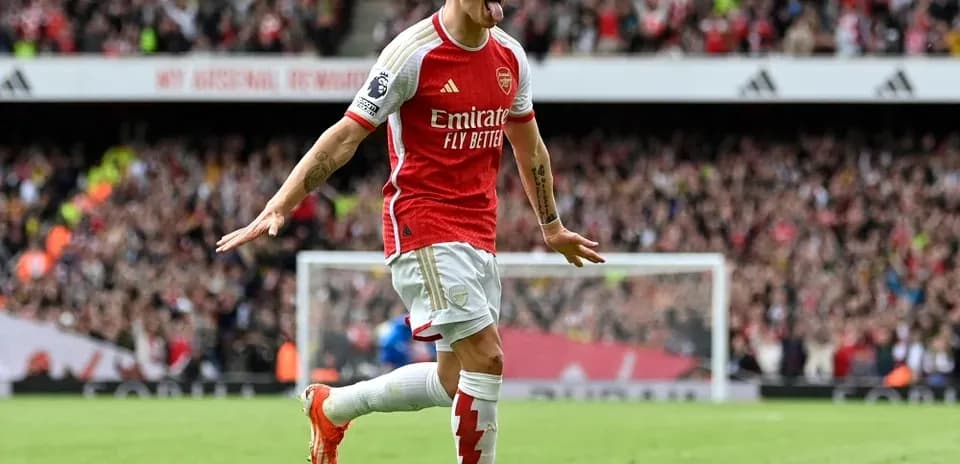 Arsenal player celebrating a goal at home stadium