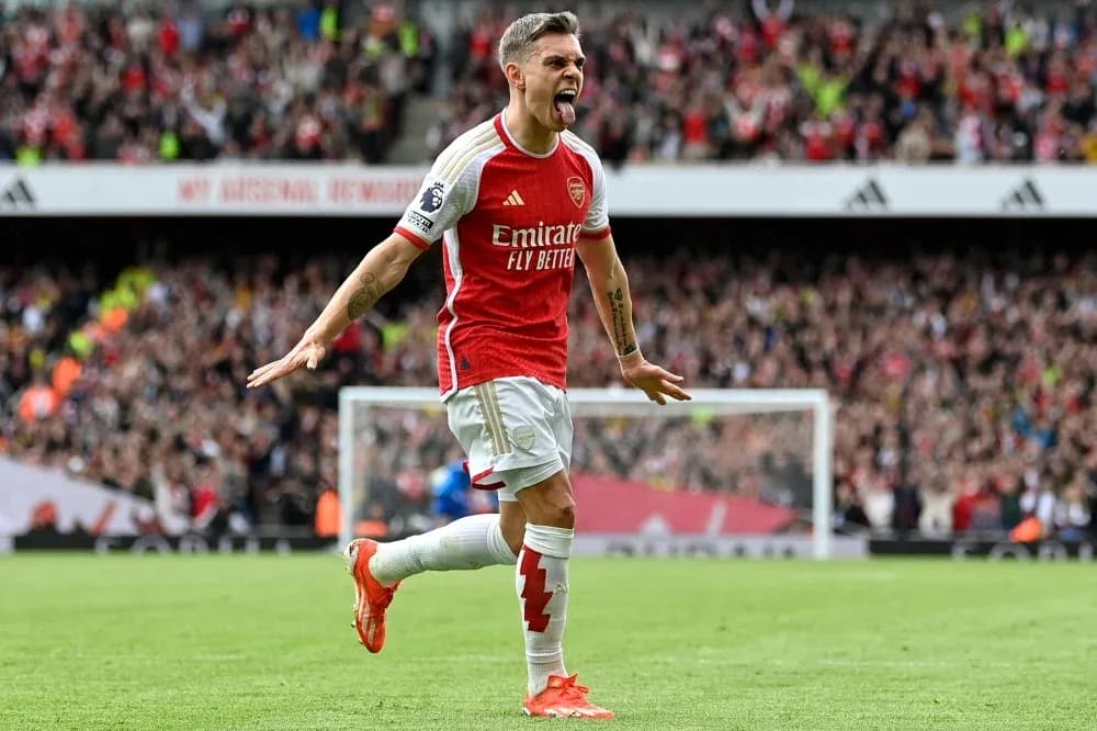 Arsenal player celebrating a goal at home stadium