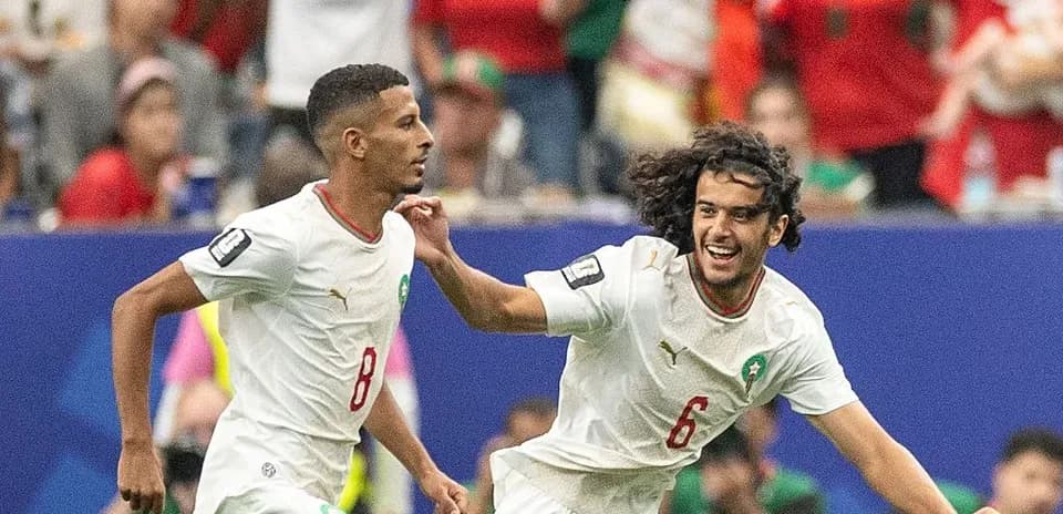 Two Moroccan players celebrating during a match