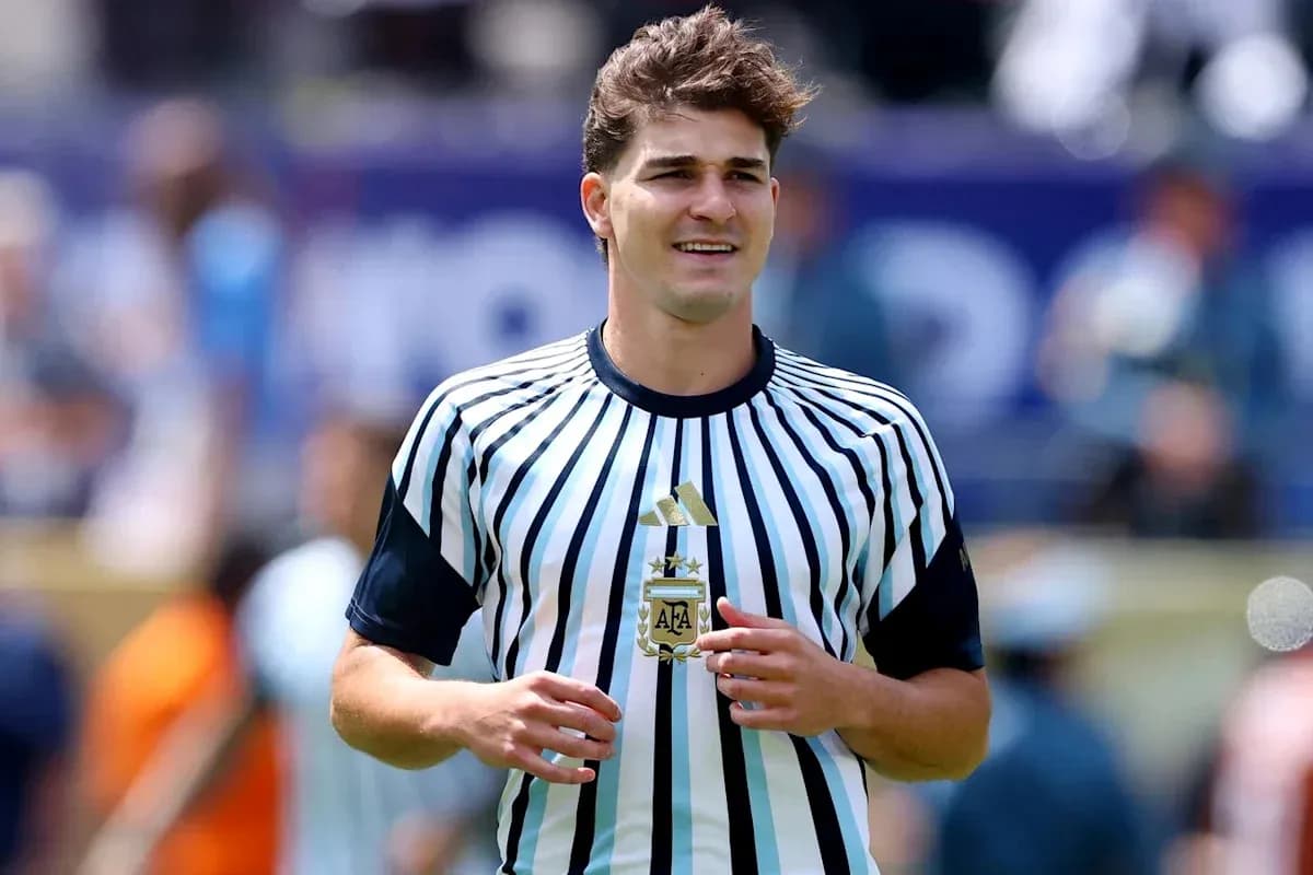 Player wearing striped Argentina jersey on field