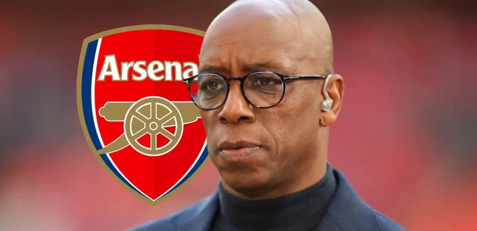 Person in front of Arsenal logo at event