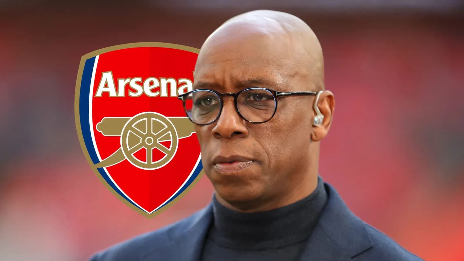 Person in front of Arsenal logo at event