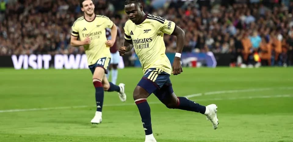 Arsenal player celebrating goal against Aston Villa