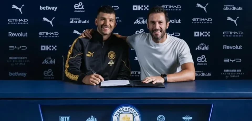 Player signing contract with manager at press conference