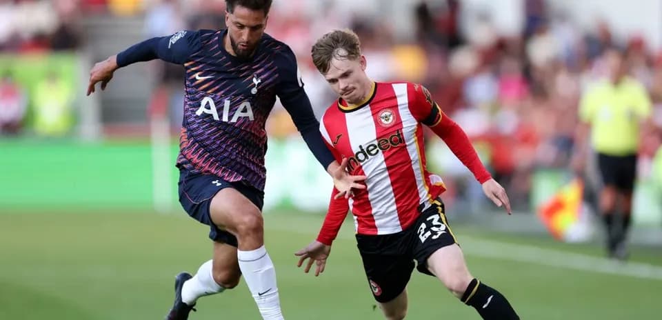 Brentford player competing with Tottenham opponent