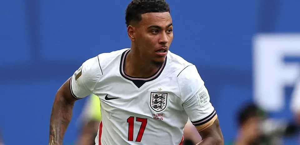 Player in England jersey running on the field