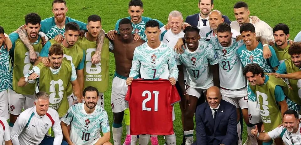 Portugal team celebrating with jersey after match