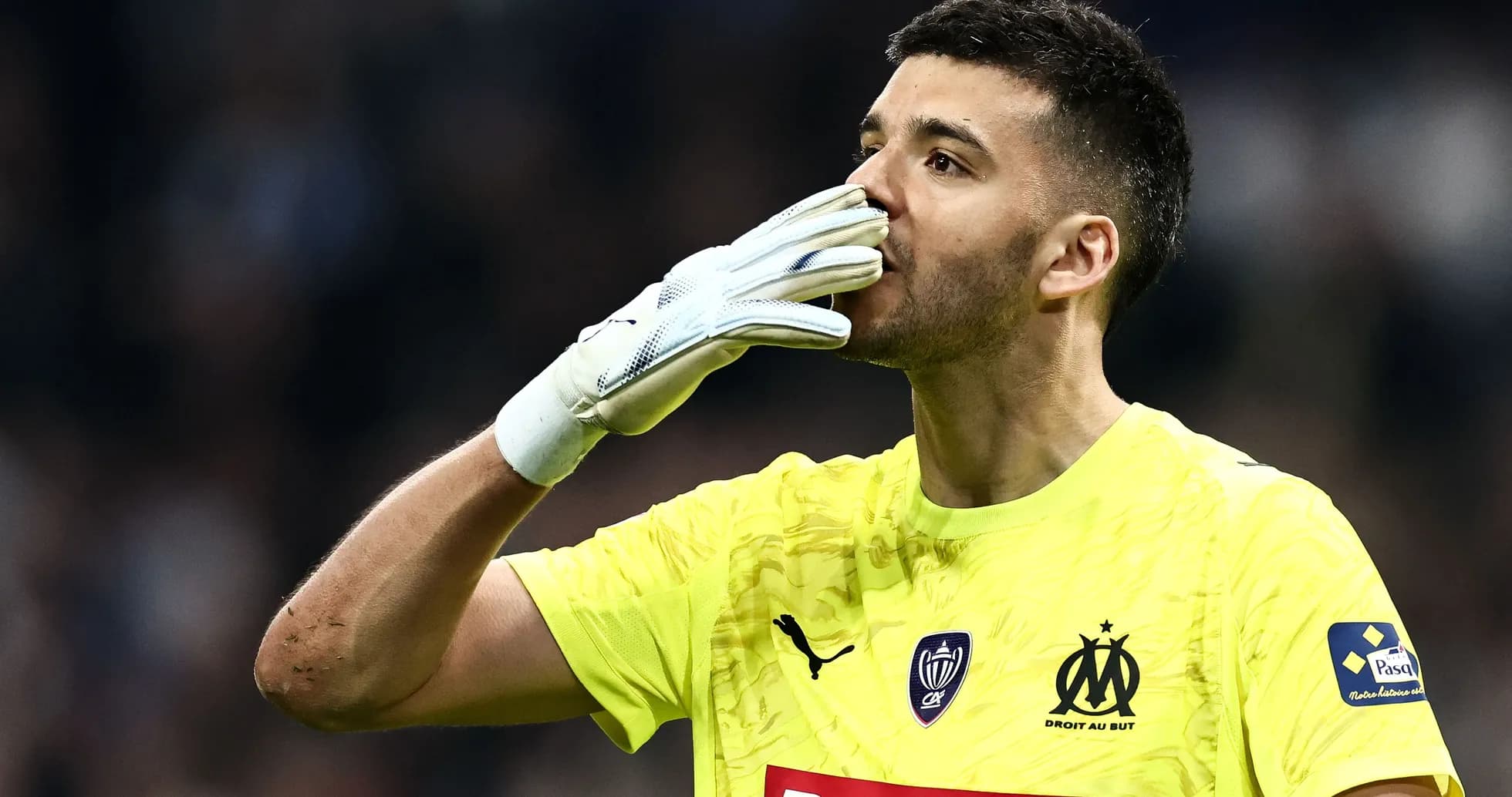 Goalkeeper celebrating with a kiss gesture