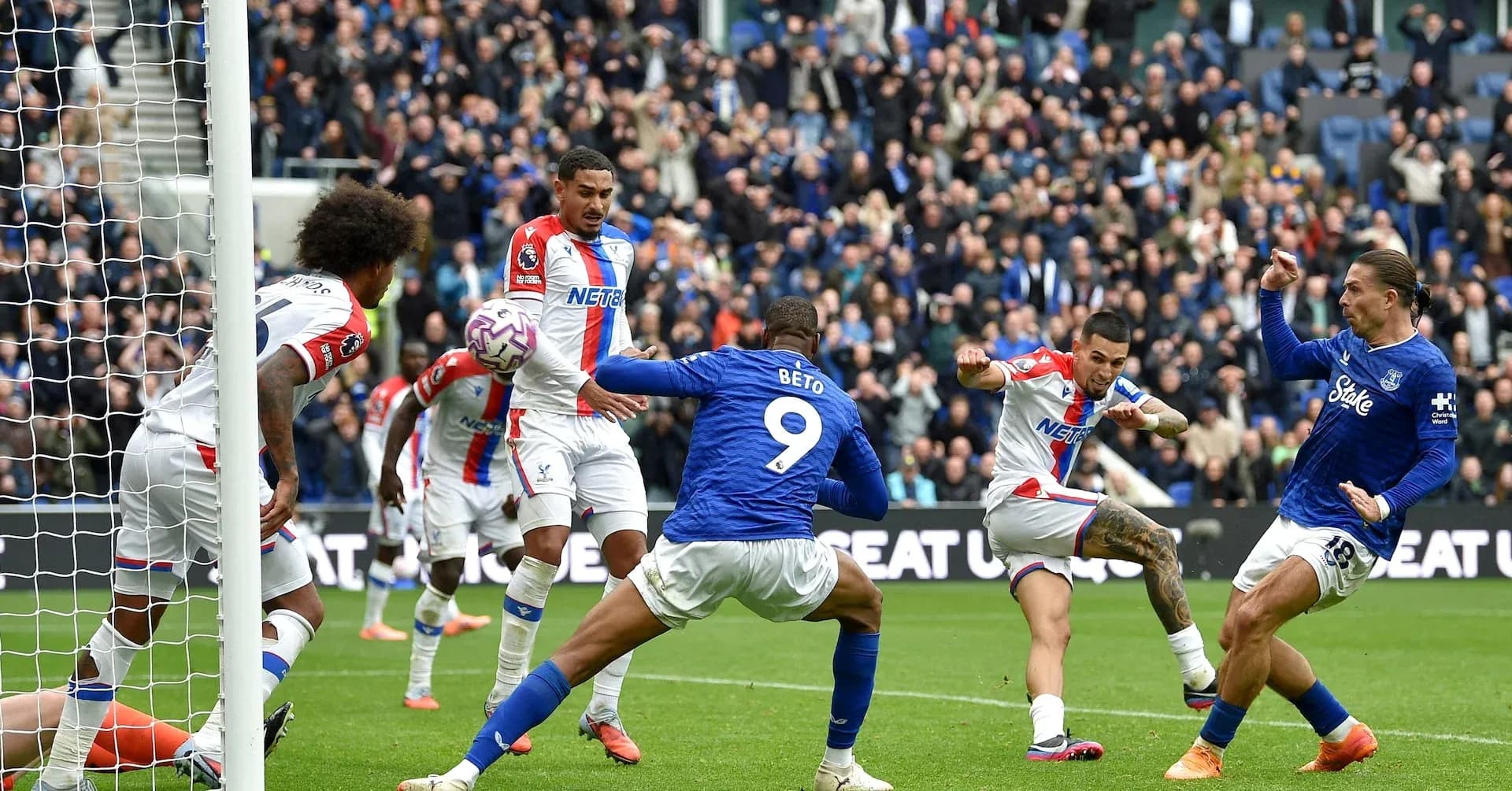 Players competing for the ball in Premier League match
