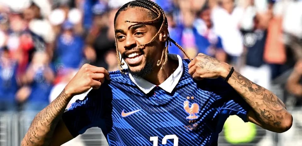 Player celebrating and showing jersey number 12