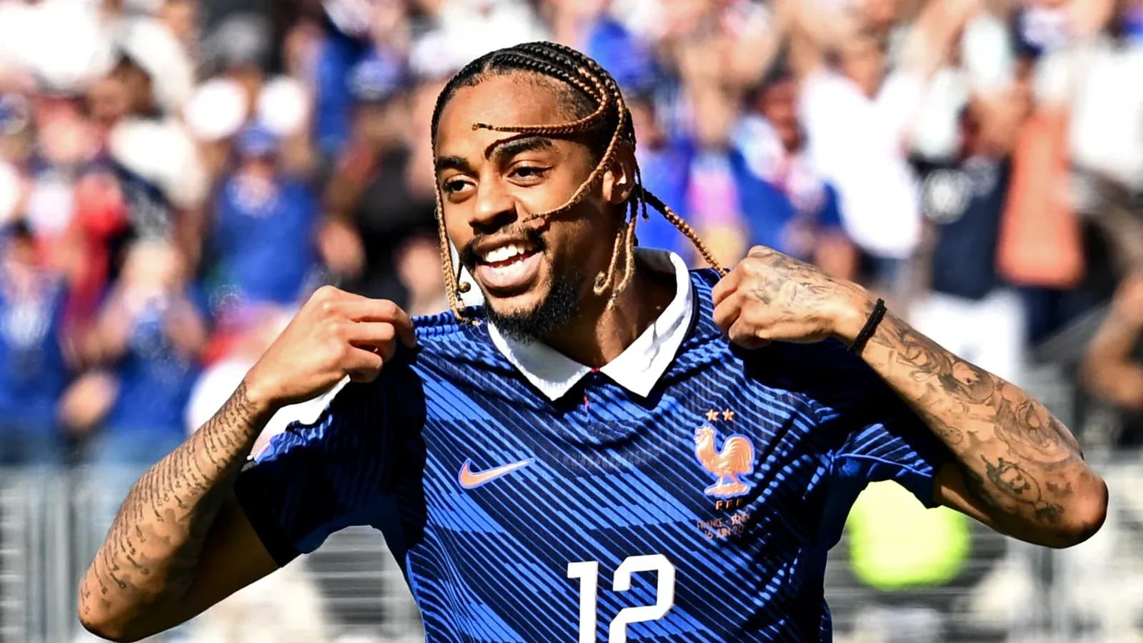 Player celebrating and showing jersey number 12