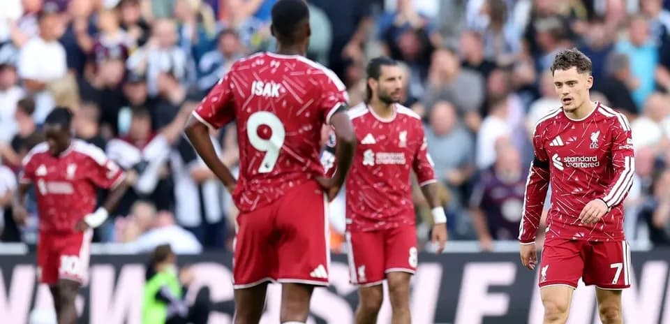 Liverpool players on the pitch after a match