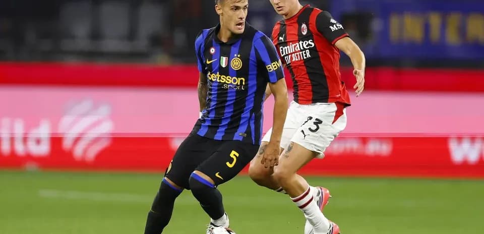Two players contesting the ball during a match
