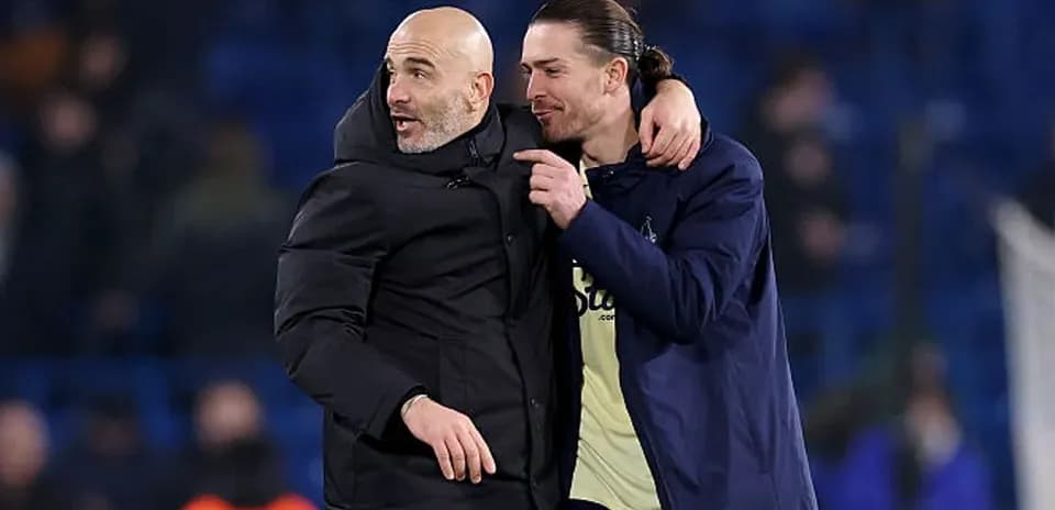 Coach and player celebrating after match victory