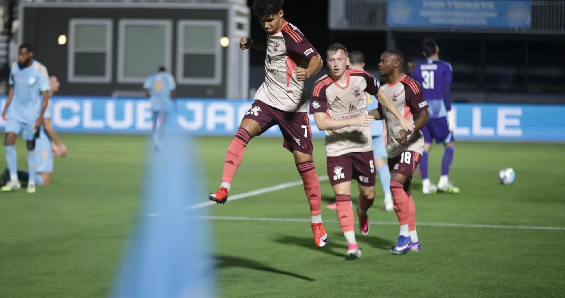 Detroit City players celebrating a goal