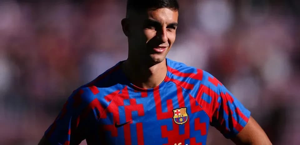 Player in Barcelona jersey smiling during event