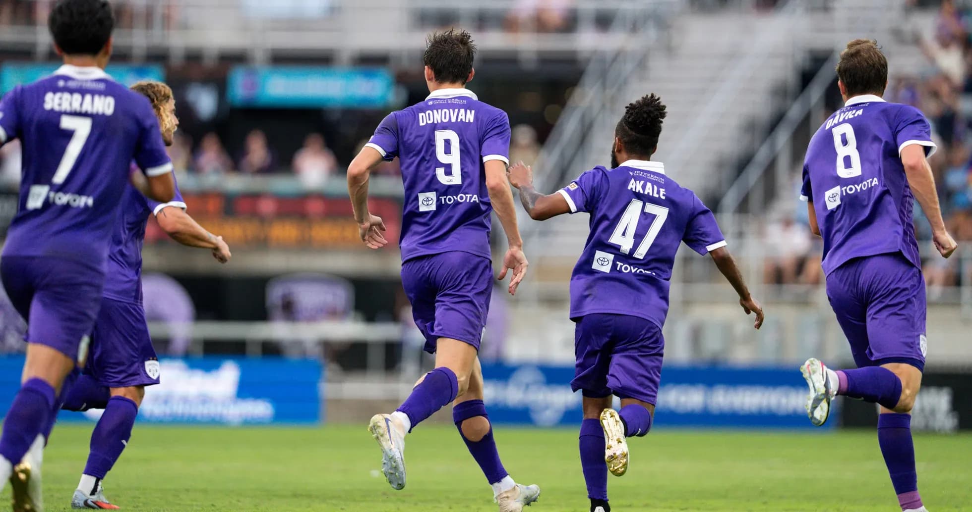 Louisville City players celebrating a goal