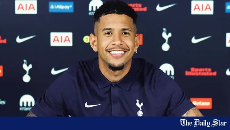 Player smiling at Tottenham press conference