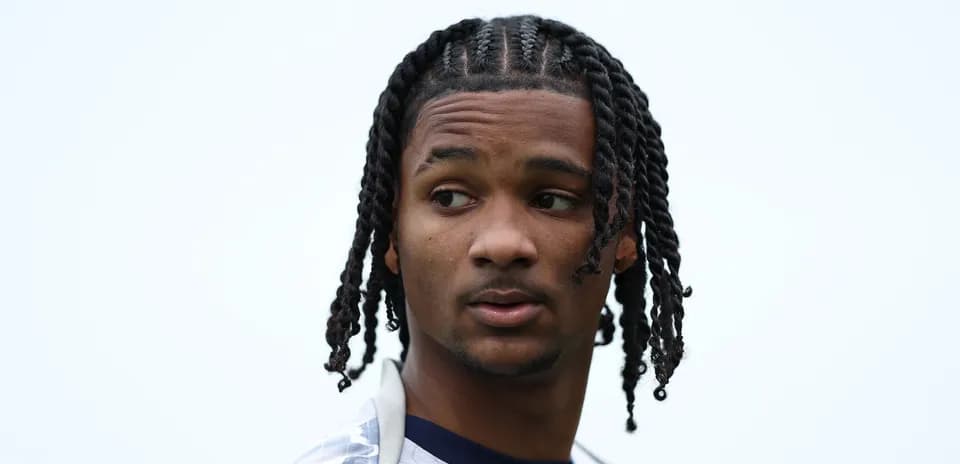 Player with braided hair looking sideways