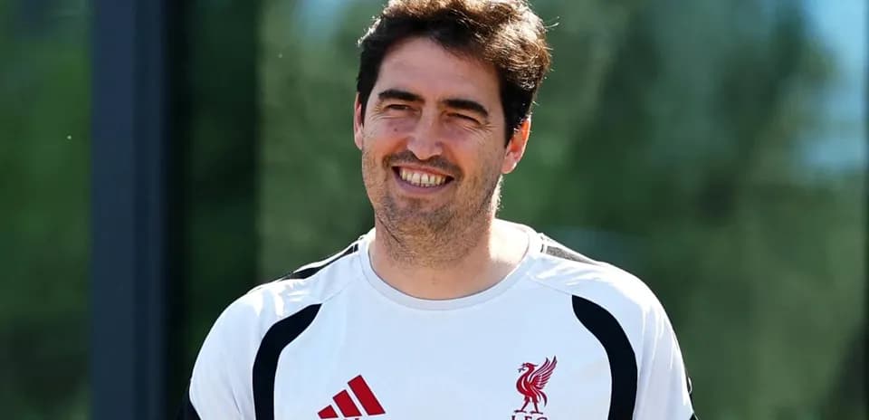 Coach smiling during Liverpool training session