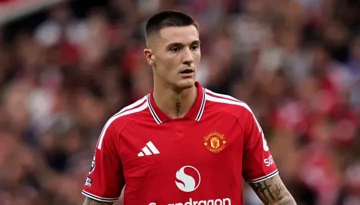 Player wearing Manchester United jersey on the pitch