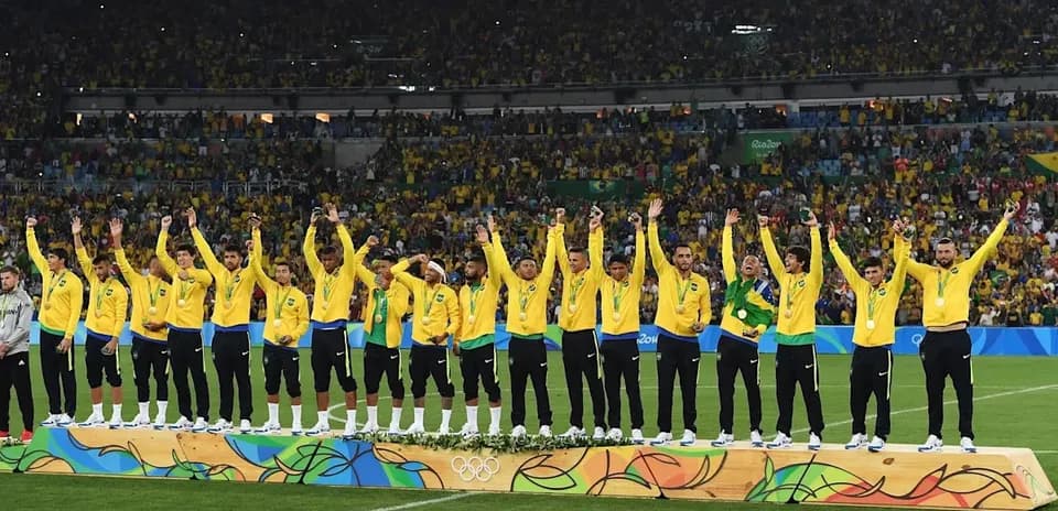 Brazilian football team celebrating on medal podium