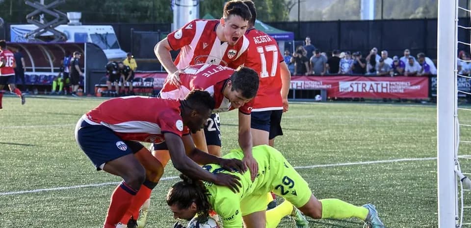 Players competing for the ball during match