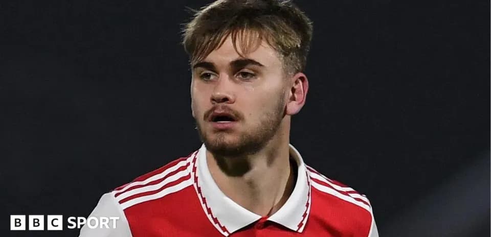 Player wearing Arsenal jersey during match