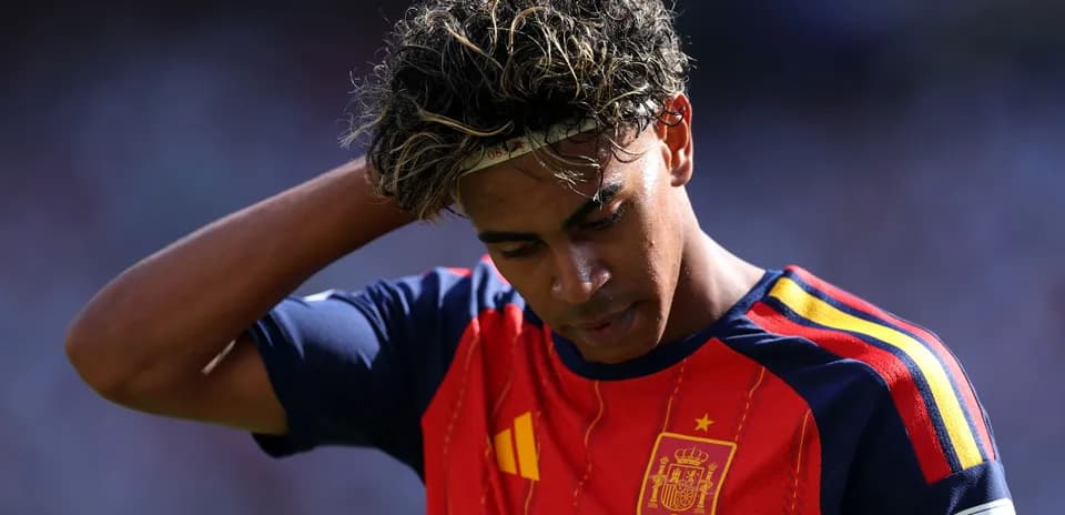 Player in Spain jersey looking down on the field